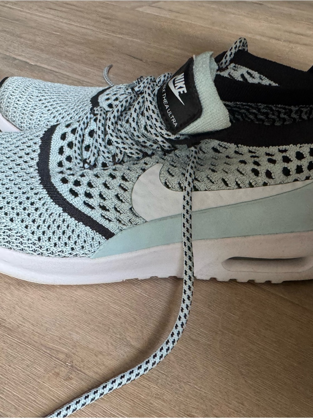 Nike Women’s Mint Blue and Black Flyknit Sneakers